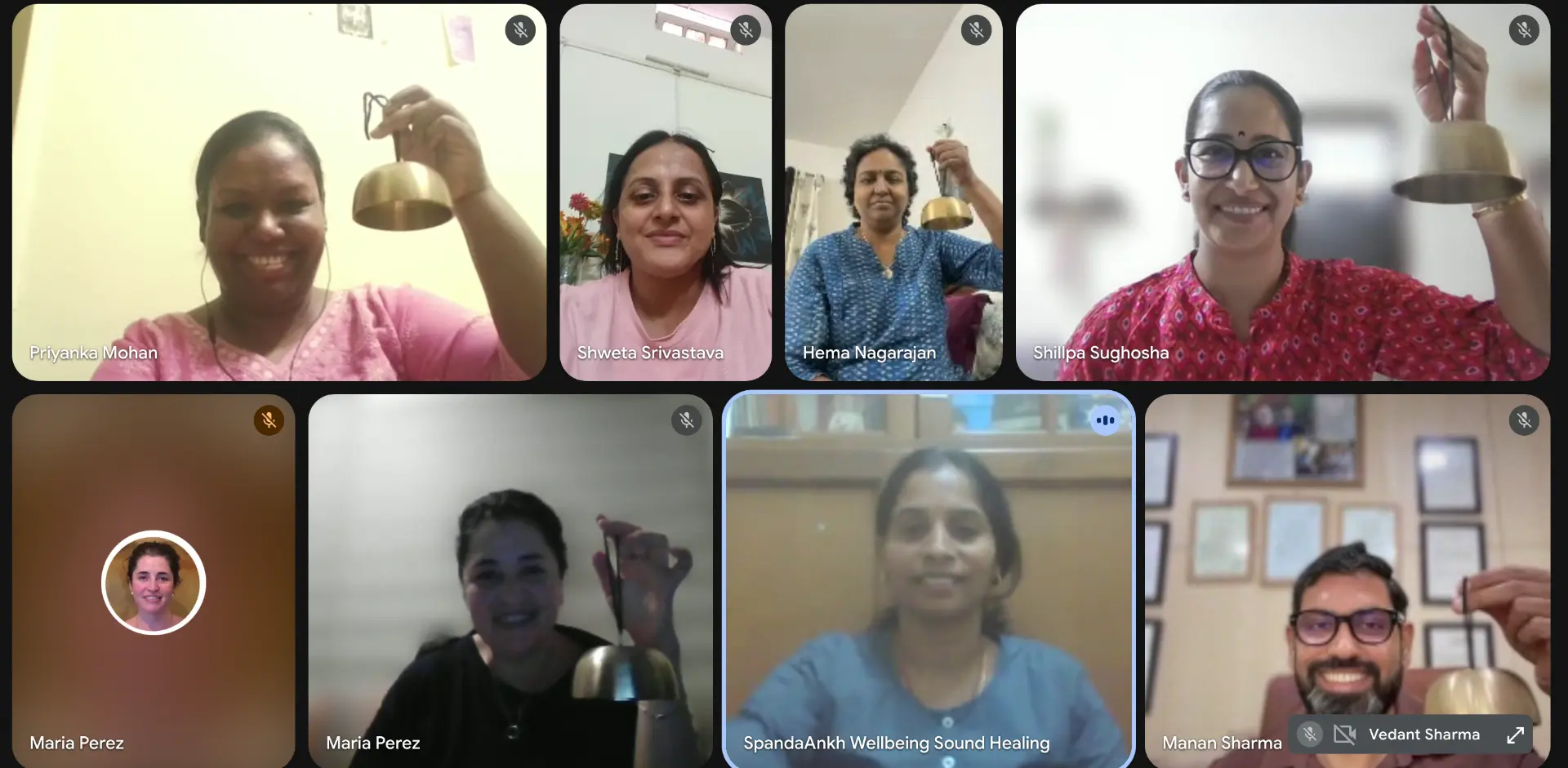 A live online training session with participants holding their bells.